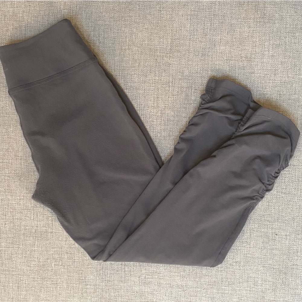 Beyond Yoga brand crop leggings with subtle ruching on side leg, gray, small.